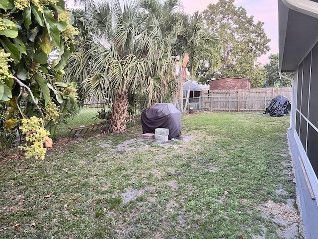 view of yard with a fenced backyard