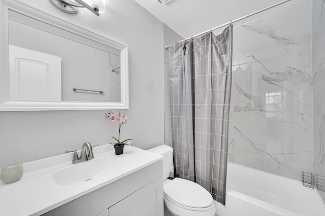 bathroom featuring shower / tub combo, vanity, and toilet