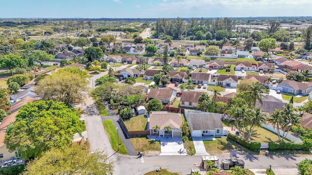 birds eye view of property with a residential view