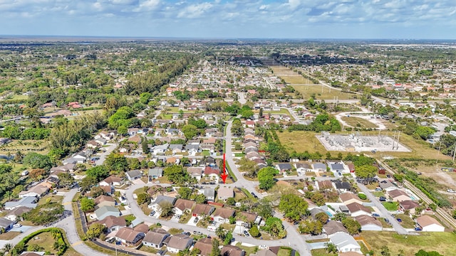 birds eye view of property with a residential view