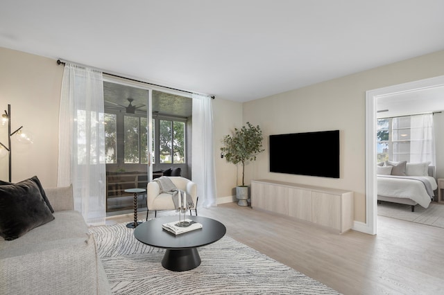 living room featuring baseboards and wood finished floors