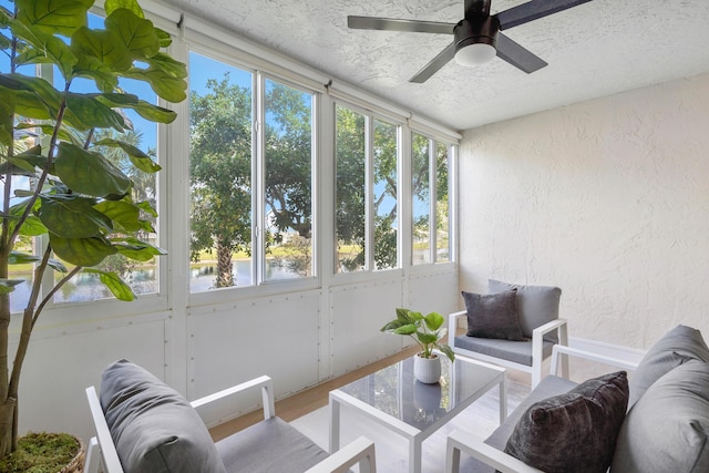 sunroom with a wealth of natural light and ceiling fan