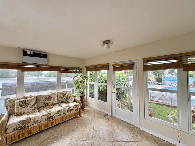 unfurnished sunroom with a wall mounted air conditioner