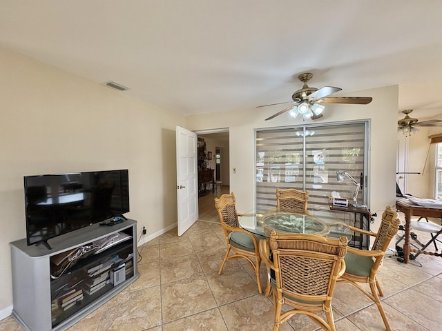 dining area featuring light tile patterned floors, ceiling fan, visible vents, and baseboards