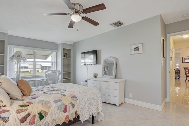 bedroom featuring visible vents, ceiling fan, baseboards, and light tile patterned floors