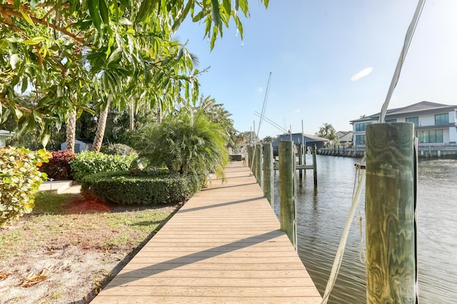 view of dock featuring a water view and boat lift