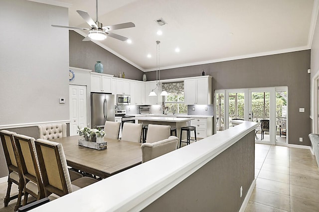 2045 NW 127th Ter, Coral Springs, FL 33071 - dining space with high vaulted ceiling, light tile patterned floors, visible vents, ceiling fan, and ornamental molding