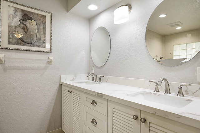 2045 NW 127th Ter, Coral Springs, FL 33071 - full bathroom featuring a sink, a textured wall, and visible vents