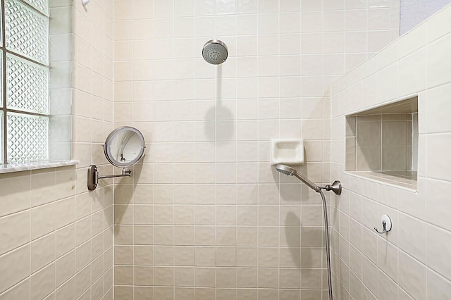 2045 NW 127th Ter, Coral Springs, FL 33071 - bathroom featuring a healthy amount of sunlight and a tile shower