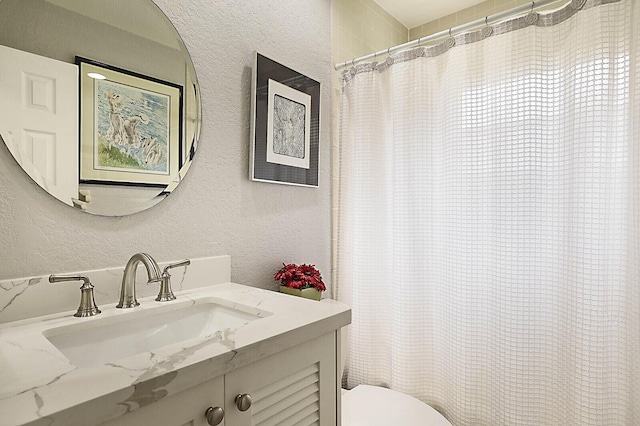 2045 NW 127th Ter, Coral Springs, FL 33071 - bathroom with toilet, vanity, a textured wall, and curtained shower