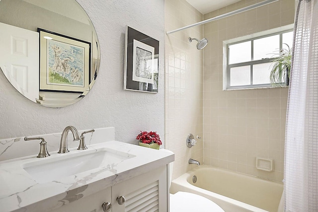 2045 NW 127th Ter, Coral Springs, FL 33071 - bathroom featuring vanity, a textured wall, toilet, and shower / tub combo