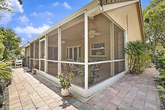 2045 NW 127th Ter, Coral Springs, FL 33071 - view of home's exterior featuring a sunroom, a patio area, and ceiling fan