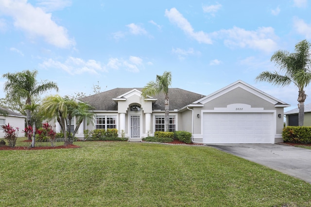 single story home with driveway, roof with shingles, an attached garage, a front lawn, and stucco siding