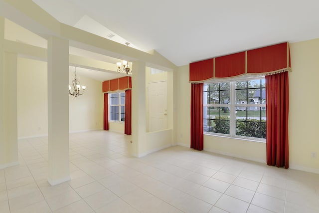 unfurnished room featuring baseboards, a chandelier, vaulted ceiling, and light tile patterned flooring