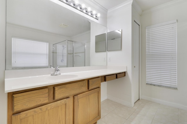 full bathroom featuring ornamental molding, a shower stall, vanity, baseboards, and tile patterned floors