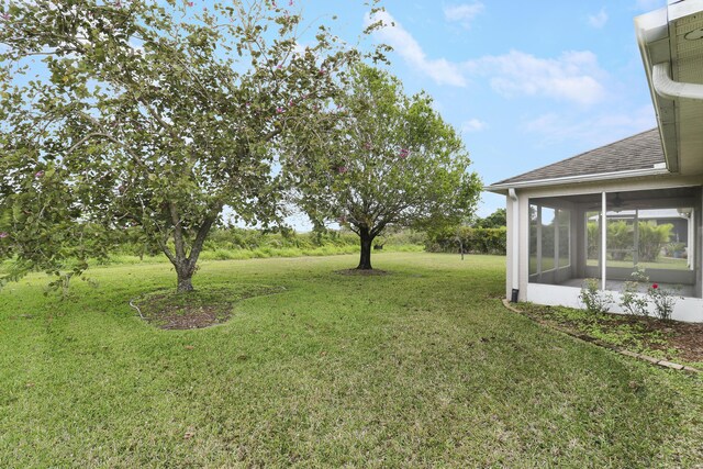 view of yard featuring a sunroom