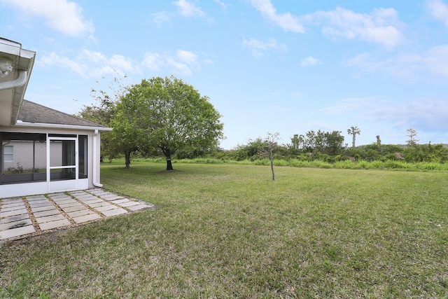 view of yard with a sunroom