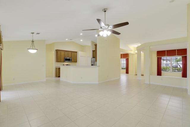 unfurnished living room with light tile patterned floors, ceiling fan, baseboards, and vaulted ceiling