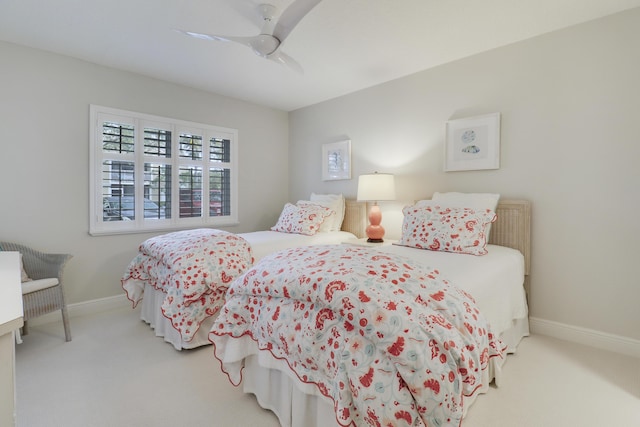 bedroom featuring baseboards, carpet floors, and ceiling fan