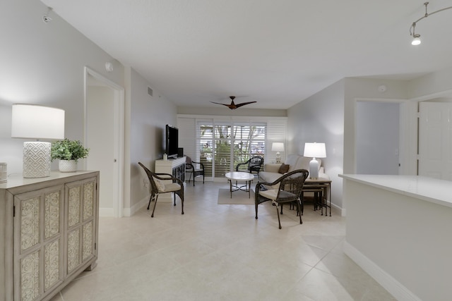 interior space featuring visible vents, ceiling fan, and baseboards