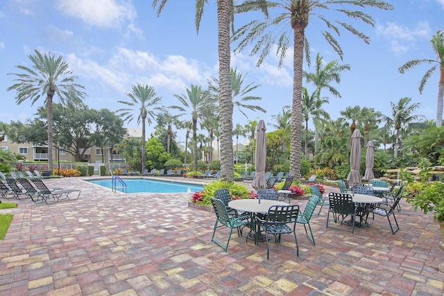 pool featuring a patio area and fence