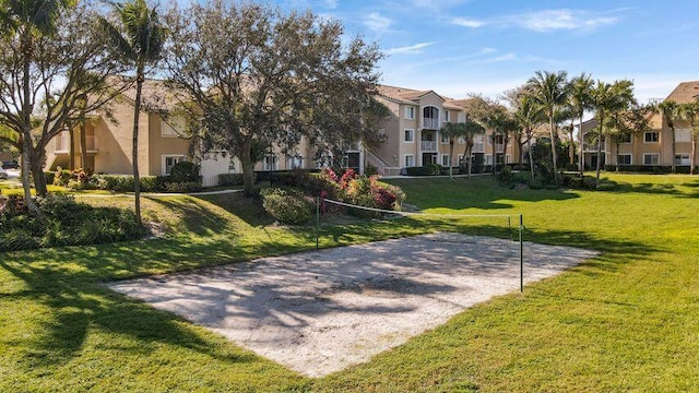 view of home's community with volleyball court, a residential view, and a yard