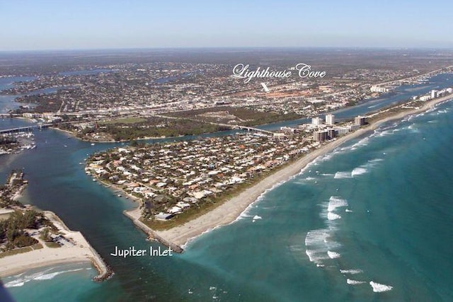 drone / aerial view with a view of the beach and a water view