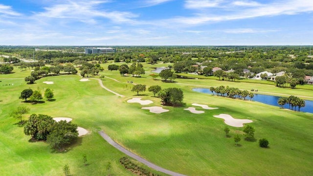 aerial view featuring golf course view and a water view