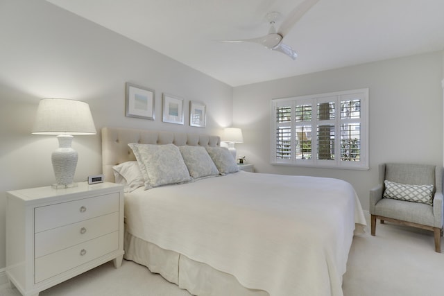 bedroom with light carpet and ceiling fan