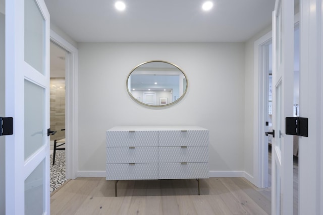 interior space with light wood-style floors, recessed lighting, and baseboards