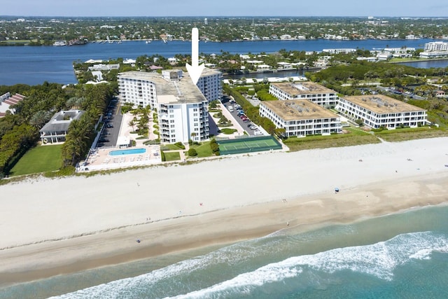 drone / aerial view featuring a view of the beach and a water view