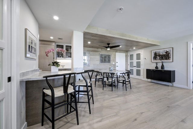 dining space with french doors, recessed lighting, visible vents, light wood-style flooring, and baseboards