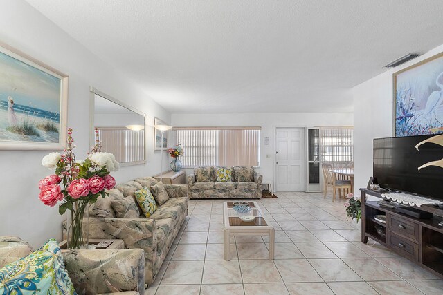 living area featuring light tile patterned floors