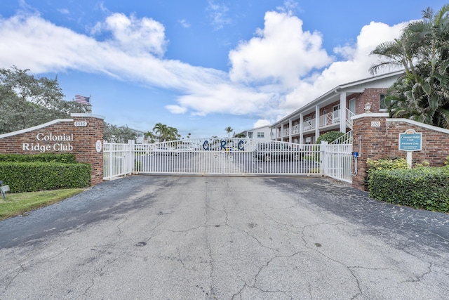 view of street with a gated entry and a gate