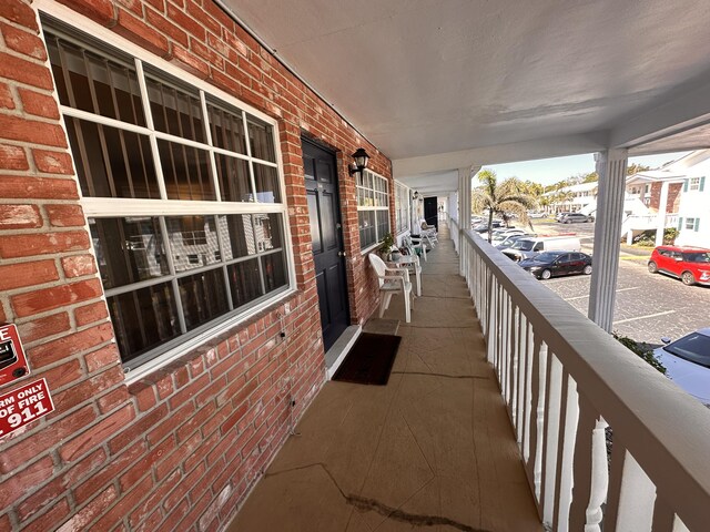 corridor featuring baseboards