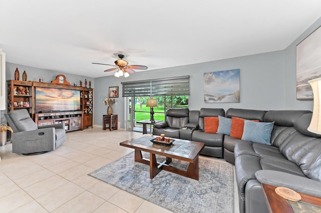 living area with light tile patterned flooring and a ceiling fan