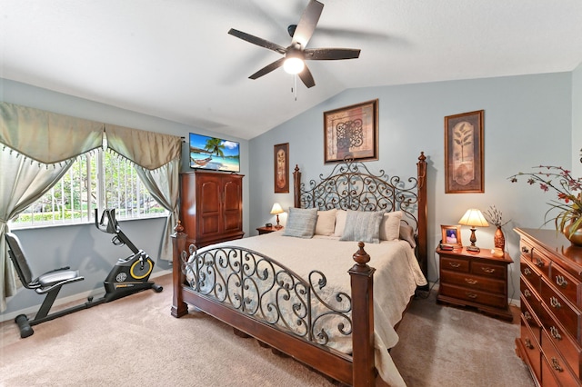 carpeted bedroom featuring lofted ceiling, ceiling fan, and baseboards