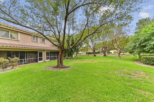 view of yard with a sunroom