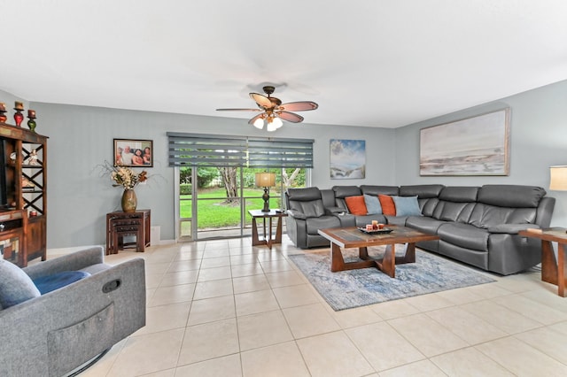 living area featuring light tile patterned flooring and ceiling fan