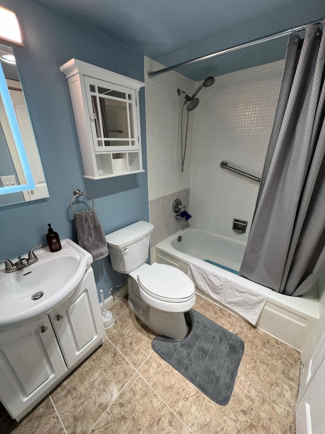 full bathroom with shower / bath combination with curtain, toilet, vanity, baseboards, and tile patterned floors