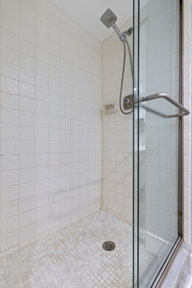 bathroom with a shower stall