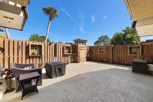 view of patio / terrace with a gate and a fenced backyard