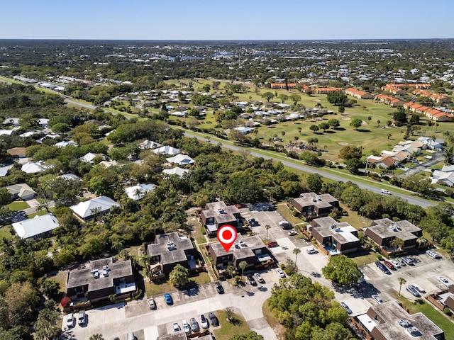 aerial view featuring view of golf course and a residential view