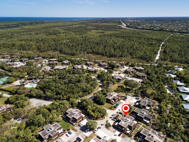 drone / aerial view featuring a forest view