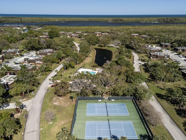 bird's eye view featuring a water view and a wooded view