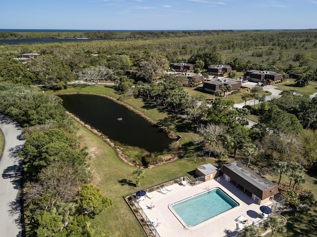 bird's eye view featuring a water view and a view of trees