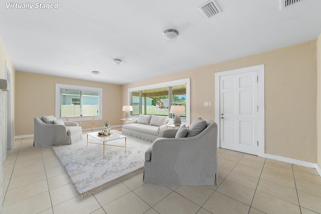 1204 Easter Ave, Fort Pierce, FL 34950 - living room featuring light tile patterned floors and baseboards