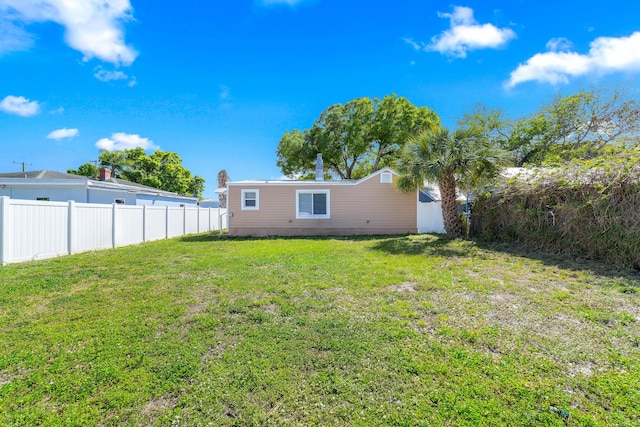 view of yard with a fenced backyard