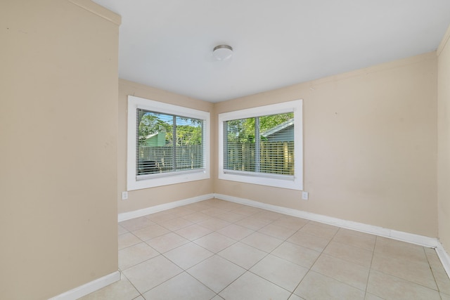 1204 Easter Ave, Fort Pierce, FL 34950 - spare room featuring light tile patterned floors and baseboards