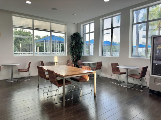 dining room featuring dark wood-style floors, recessed lighting, and baseboards